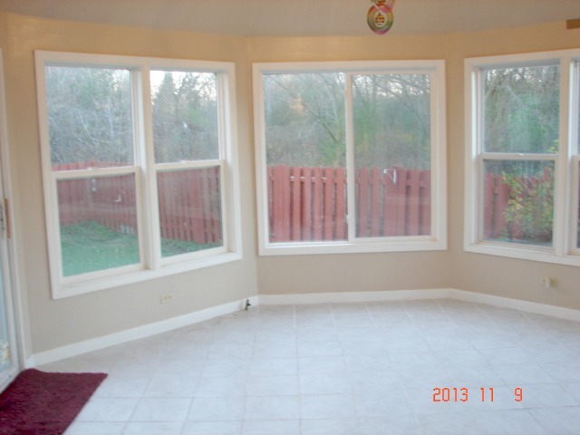 5353 Joshua Court Gurnee, IL 60031 - Photo 8 of 22 an empty room with a window