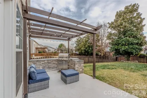 a room with lots of trees and furniture