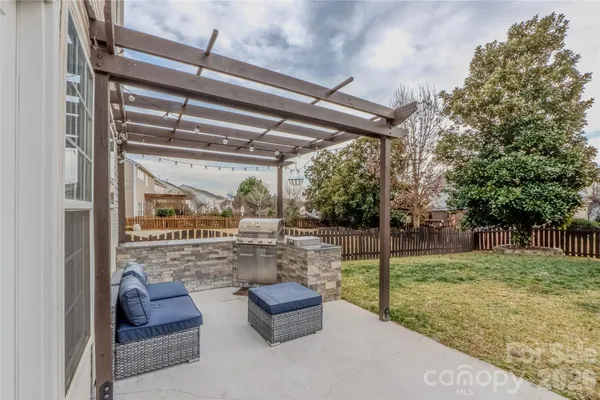a room with lots of trees and furniture