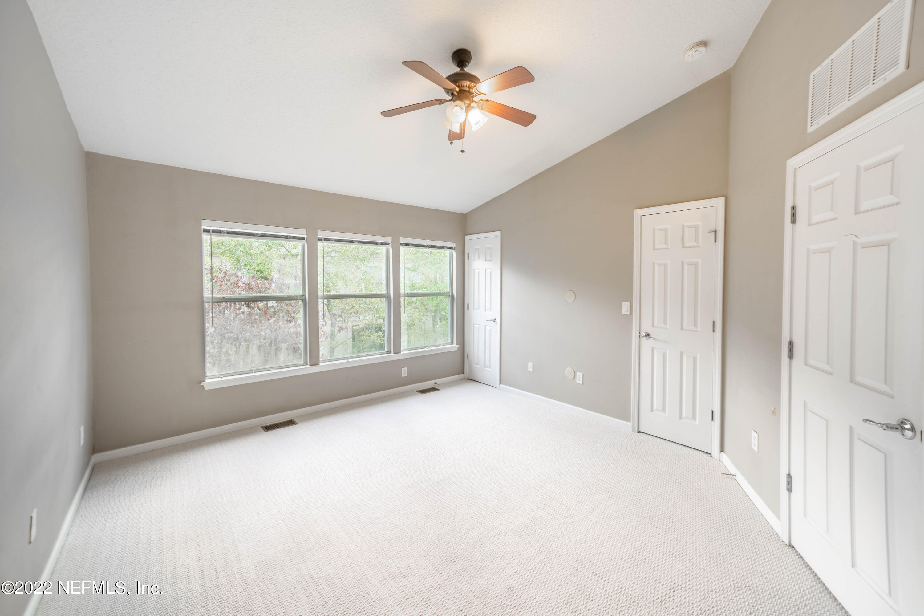 8085 Summerside Circle Jacksonville, FL 32256 - Photo 12 of 21 a big room with chandelier fan and windows