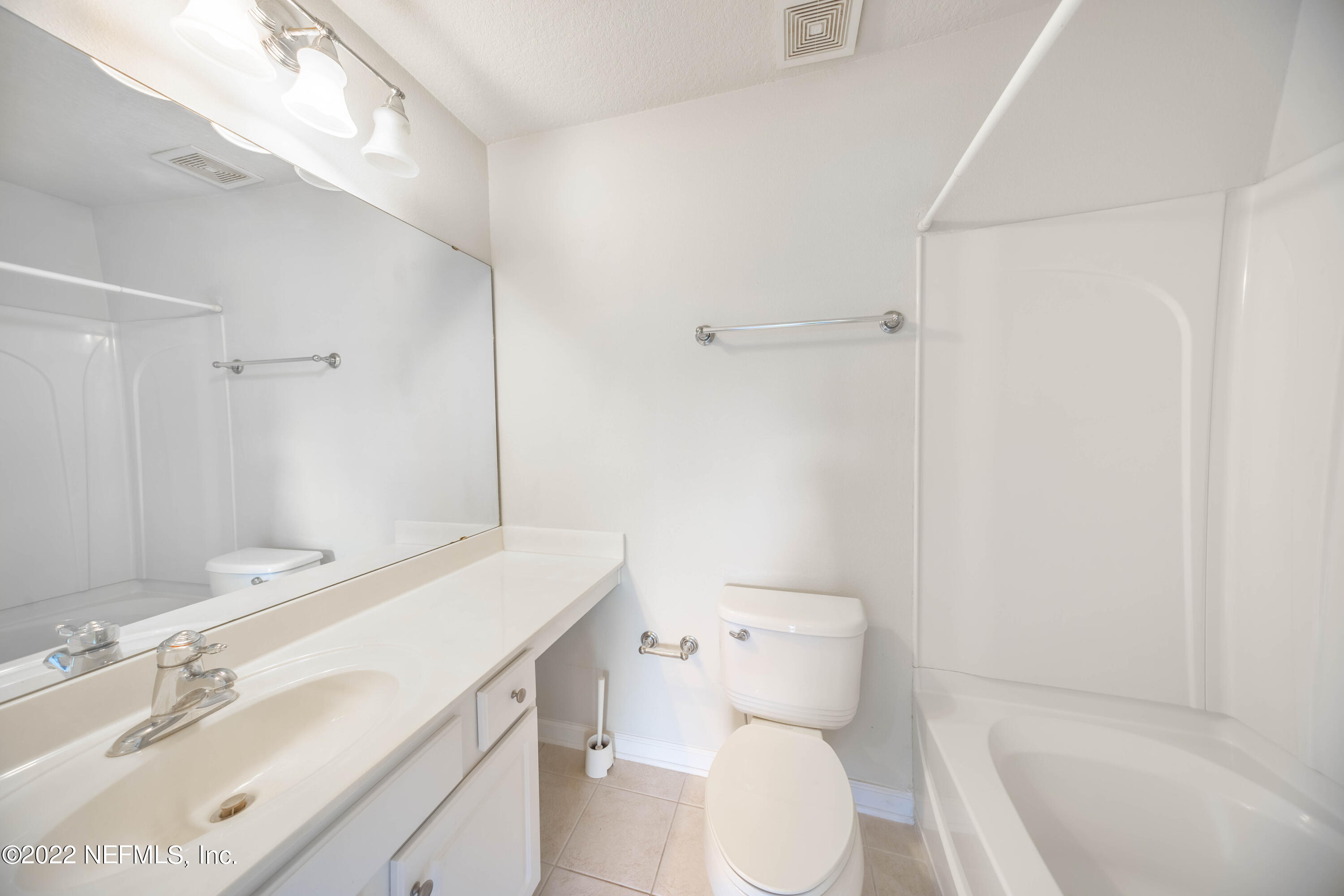 8085 Summerside Circle Jacksonville, FL 32256 - Photo 17 of 21 a bathroom with a sink a toilet and shower