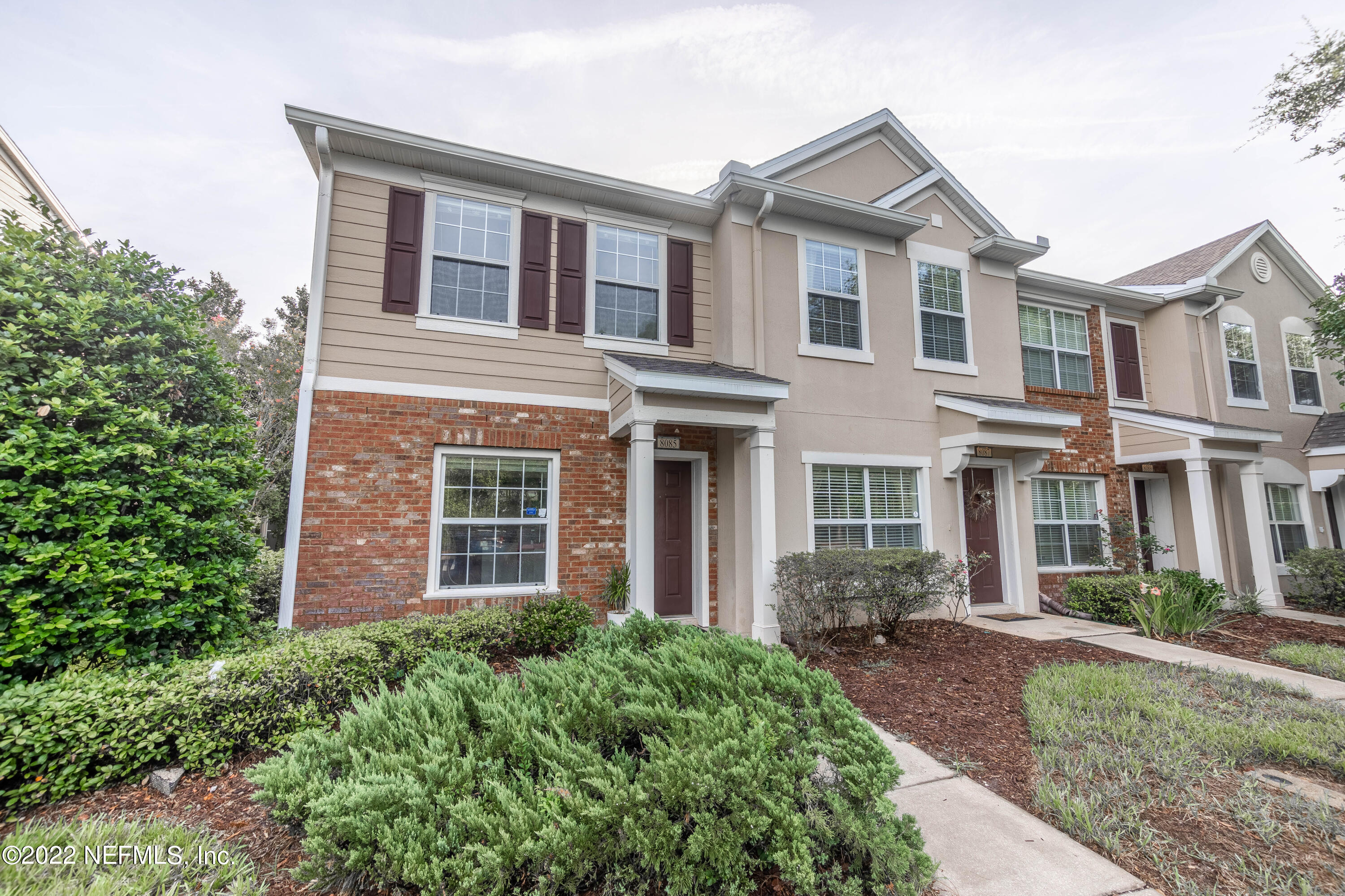 8085 Summerside Circle Jacksonville, FL 32256 - Photo 21 of 21 front view of brick house with a yard
