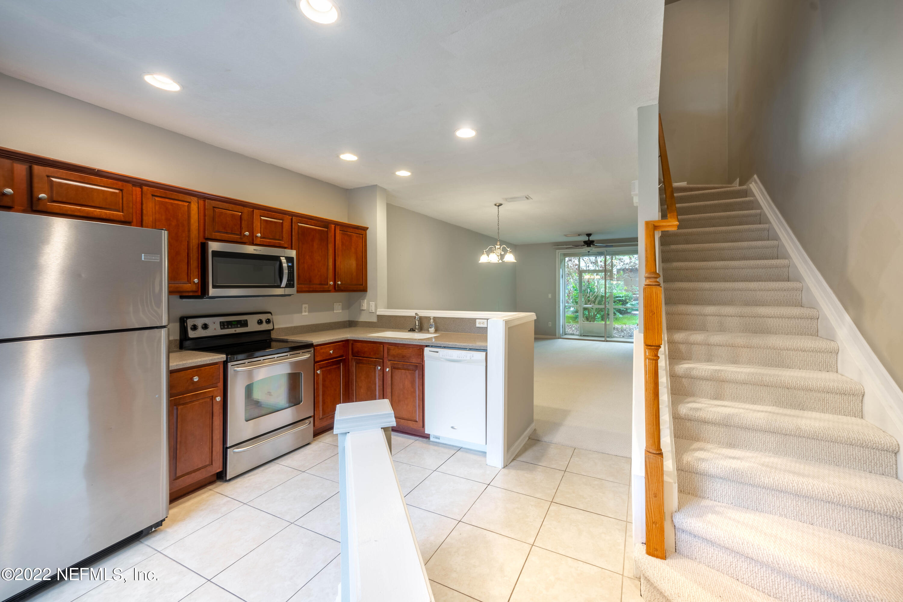 8085 Summerside Circle Jacksonville, FL 32256 - Photo 6 of 21 a kitchen with stainless steel appliances granite countertop a refrigerator and a stove top oven