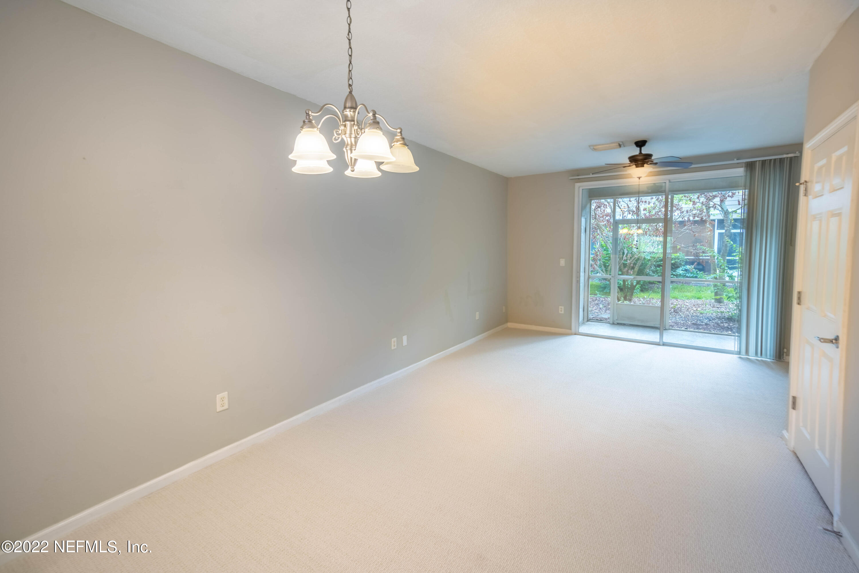 8085 Summerside Circle Jacksonville, FL 32256 - Photo 7 of 21 a view of a chandelier in big room and windows