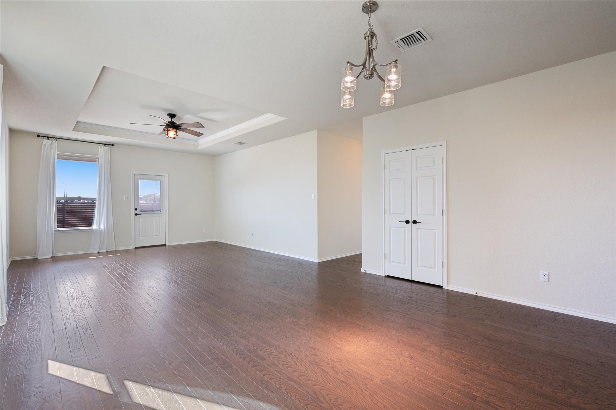 2044 Cliffbrake Way Georgetown, TX 78626 - Photo 13 of 40 View from Kitchen into the Dining Room and Living Room.
