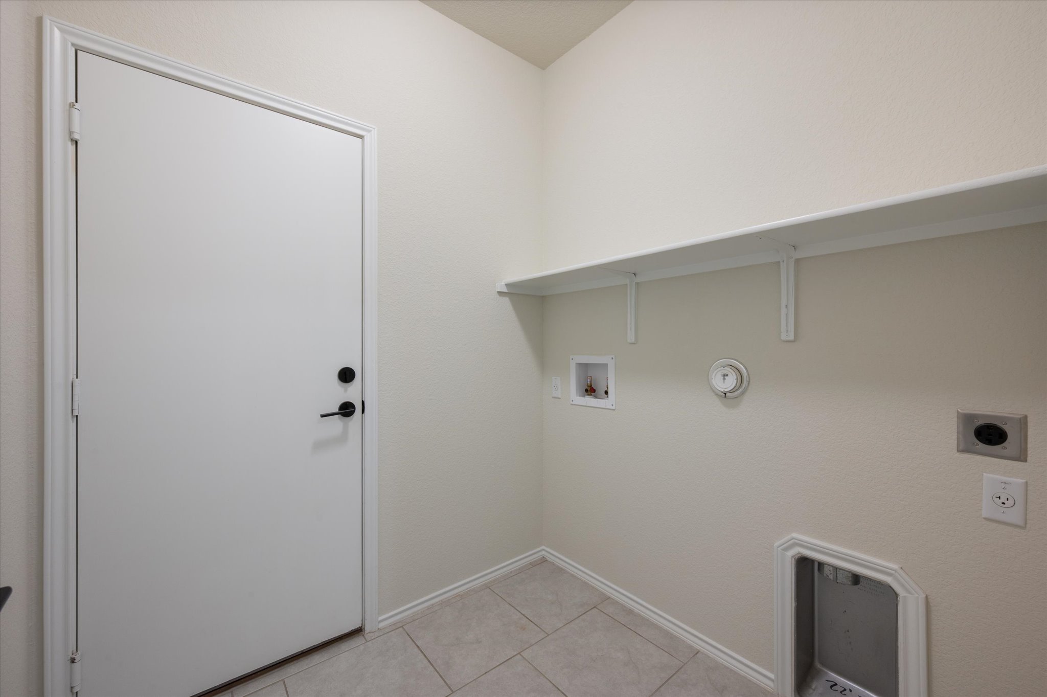 2044 Cliffbrake Way Georgetown, TX 78626 - Photo 23 of 40 Laundry room with washer dryer hookups. Ceramic tile flooring.