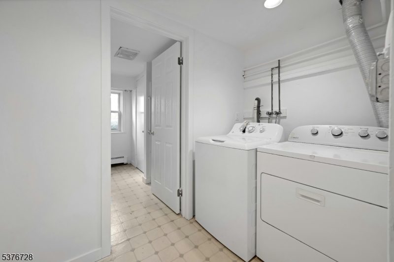 59 Main Street Peapack-Gladstone, NJ 07977 - Photo 28 of 30 a bathroom with a sink and a mirror