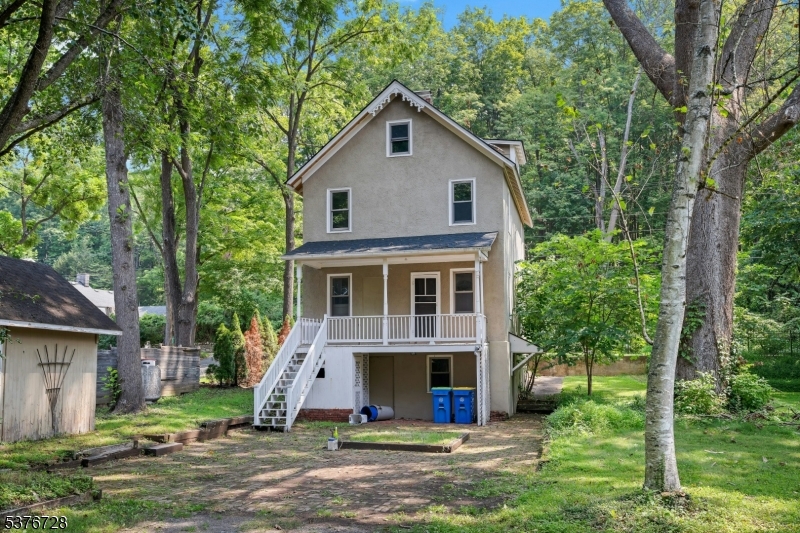 59 Main Street Peapack-Gladstone, NJ 07977 - Photo 29 of 30 a front view of a house with garden