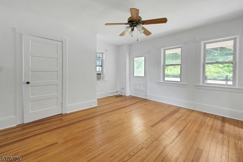 59 Main Street Peapack-Gladstone, NJ 07977 - Photo 5 of 30 a view of empty room with wooden floor and fan
