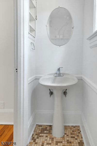 59 Main Street Peapack-Gladstone, NJ 07977 - Photo 7 of 30 a bathroom with a sink and a mirror