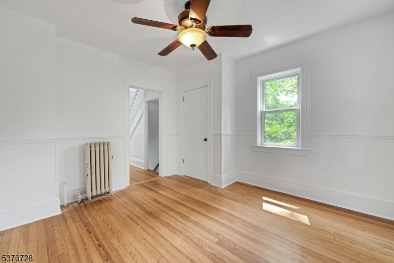 59 Main Street Peapack-Gladstone, NJ 07977 - Photo 9 of 30 a view of empty room with wooden floor and fan