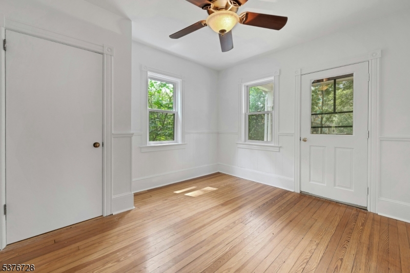 59 Main Street Peapack-Gladstone, NJ 07977 - Photo 10 of 30 a view of an empty room with wooden floor and a window