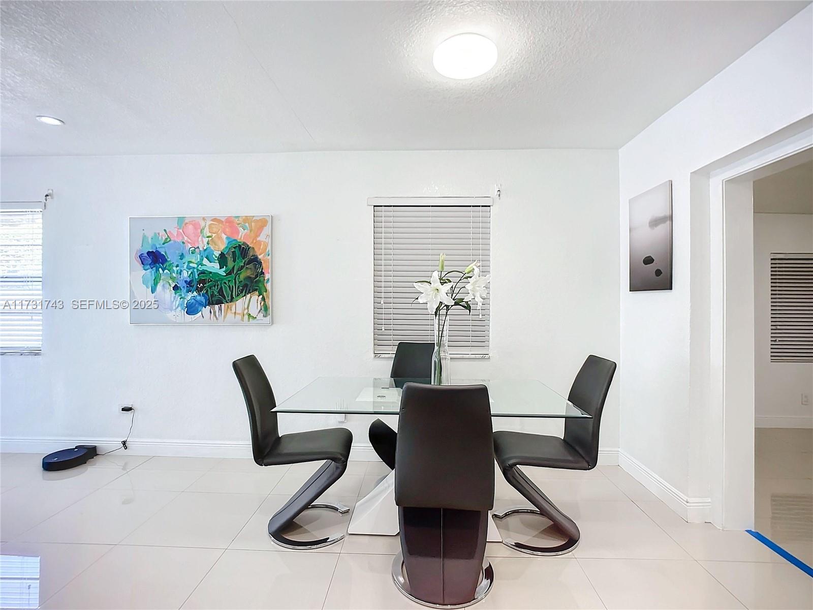 35 Southwest 63rd Court Miami, FL 33144 - Photo 11 of 42 a view of a workspace with furniture and a window