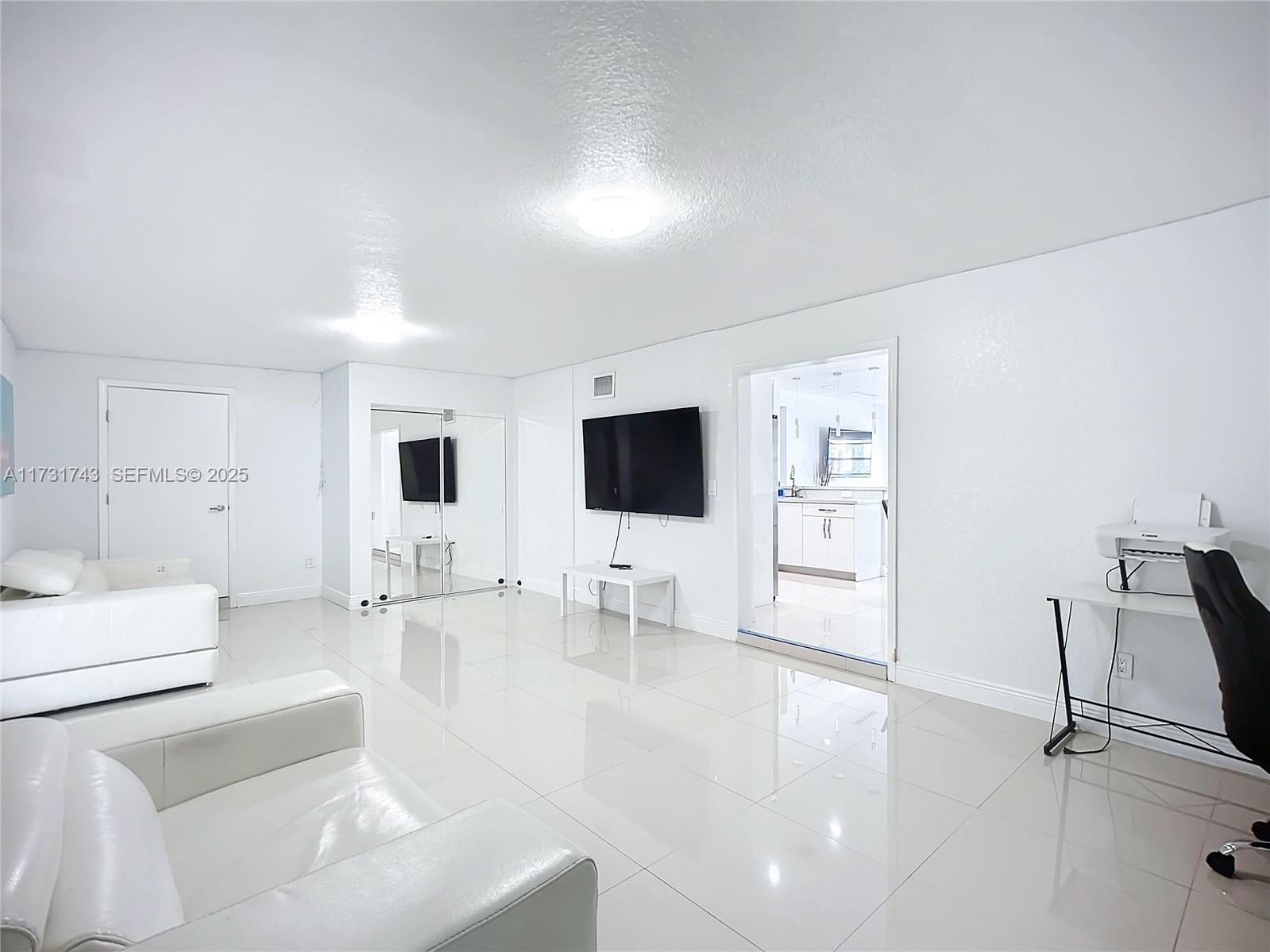 35 Southwest 63rd Court Miami, FL 33144 - Photo 15 of 42 a living room with furniture and a flat screen tv