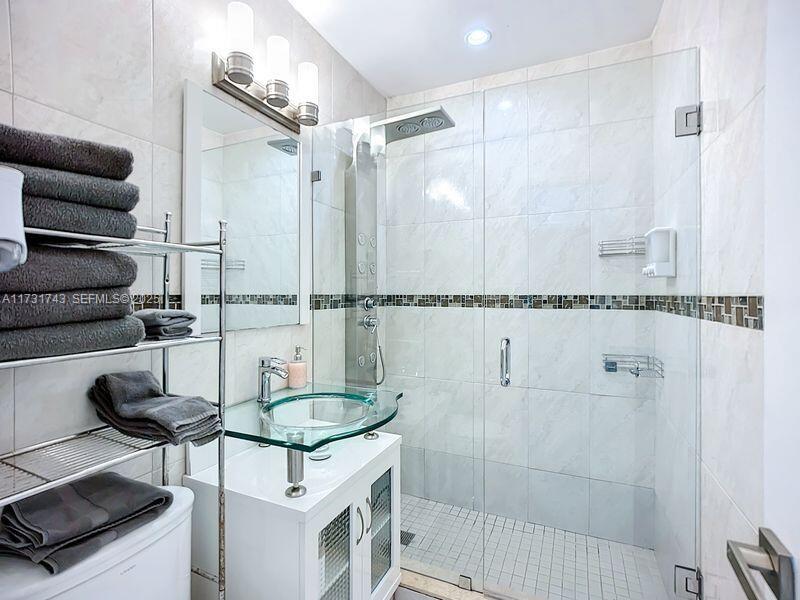 35 Southwest 63rd Court Miami, FL 33144 - Photo 20 of 42 a bathroom with a bathtub and shower