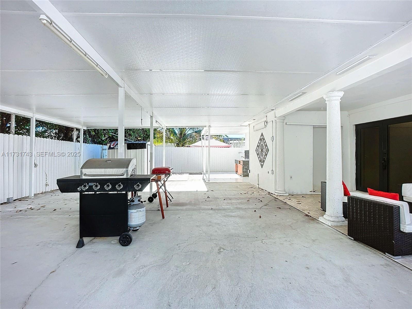 35 Southwest 63rd Court Miami, FL 33144 - Photo 26 of 42 a living room with furniture and a flat screen tv