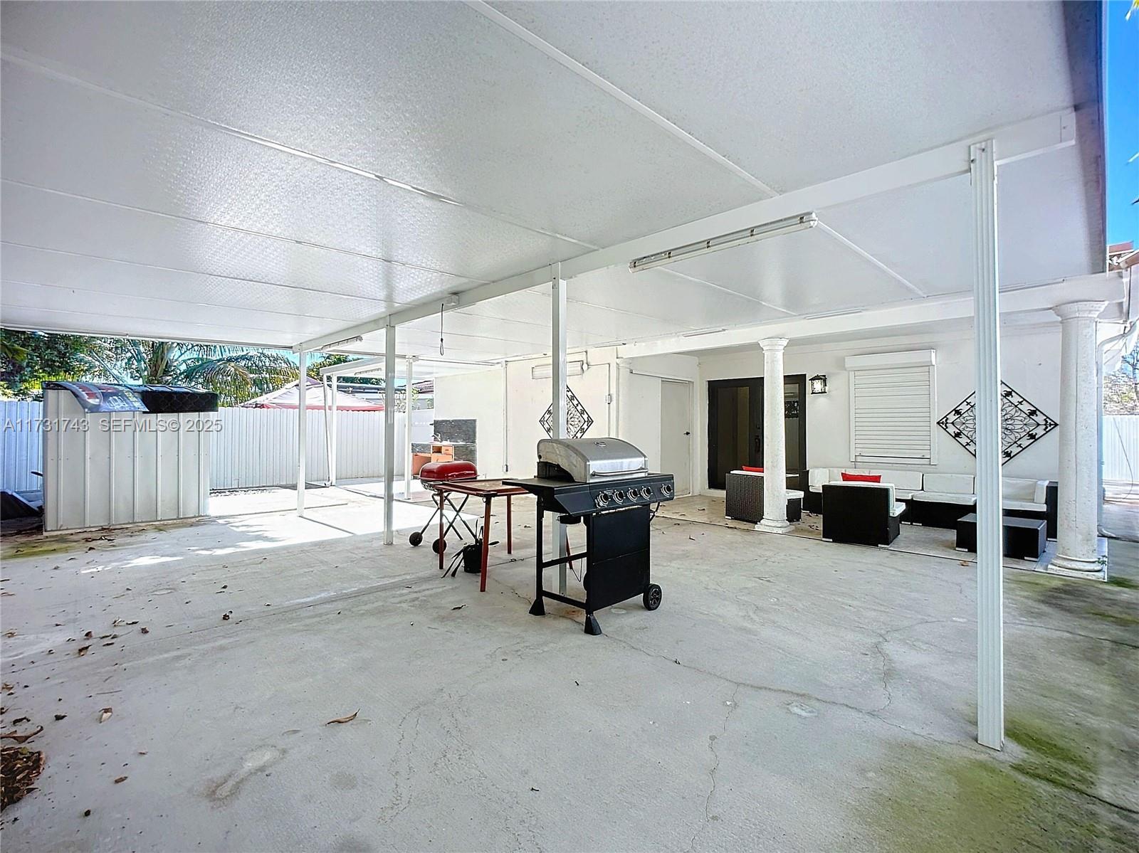 35 Southwest 63rd Court Miami, FL 33144 - Photo 28 of 42 a view of a patio with table and chairs