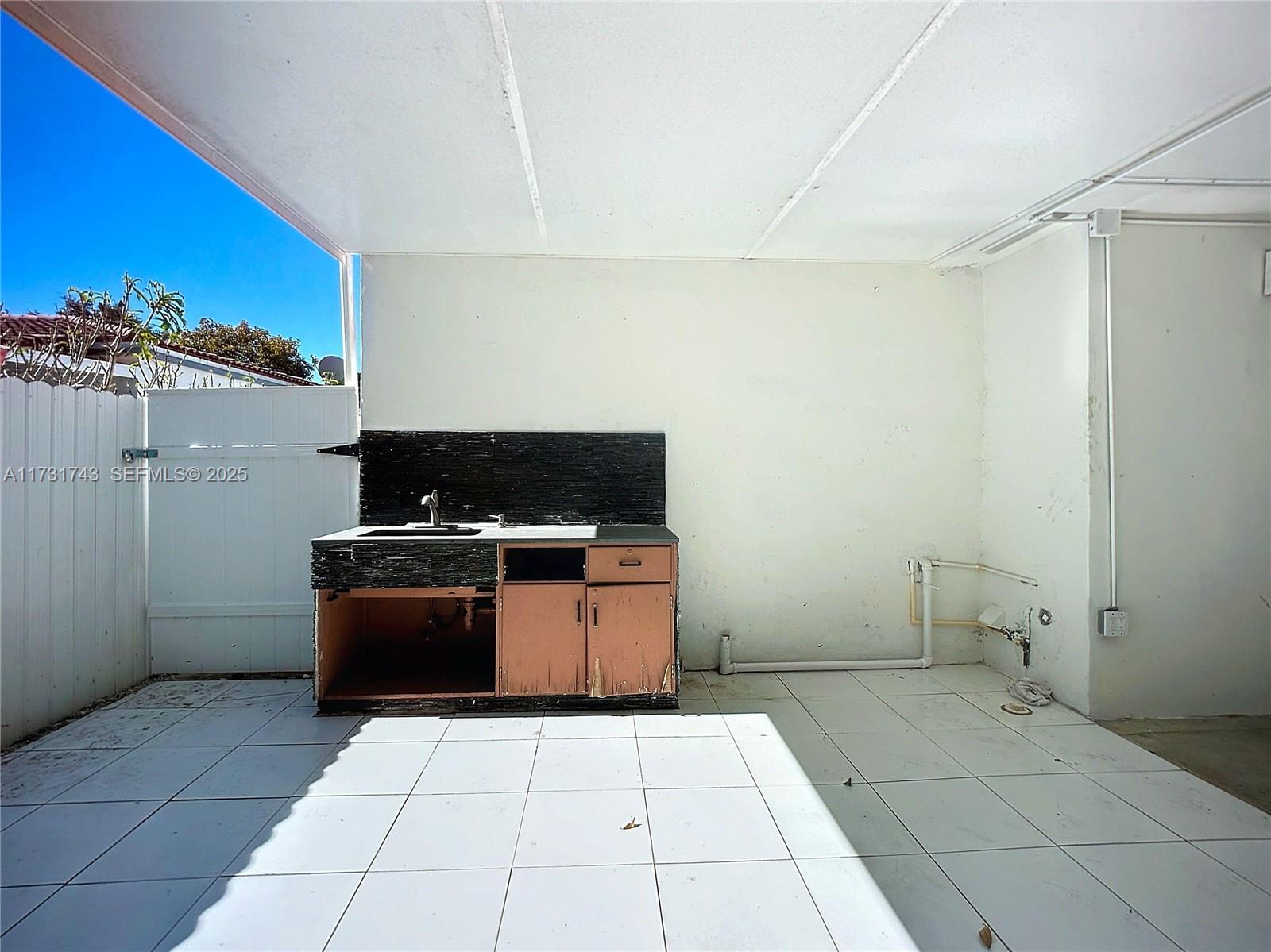 35 Southwest 63rd Court Miami, FL 33144 - Photo 29 of 42 a kitchen with a stove and a refrigerator