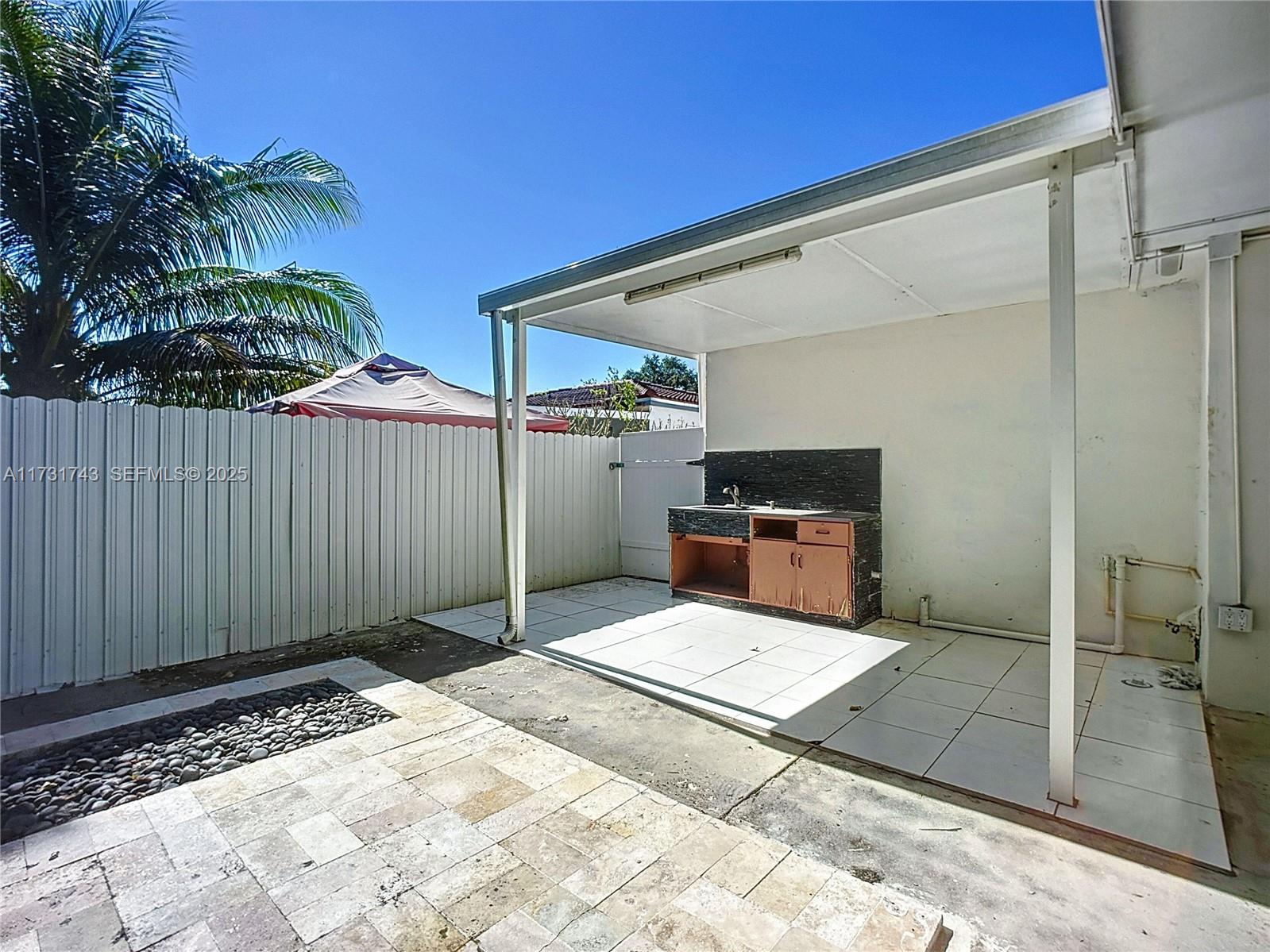 35 Southwest 63rd Court Miami, FL 33144 - Photo 30 of 42 a view of a backyard space with potted plants