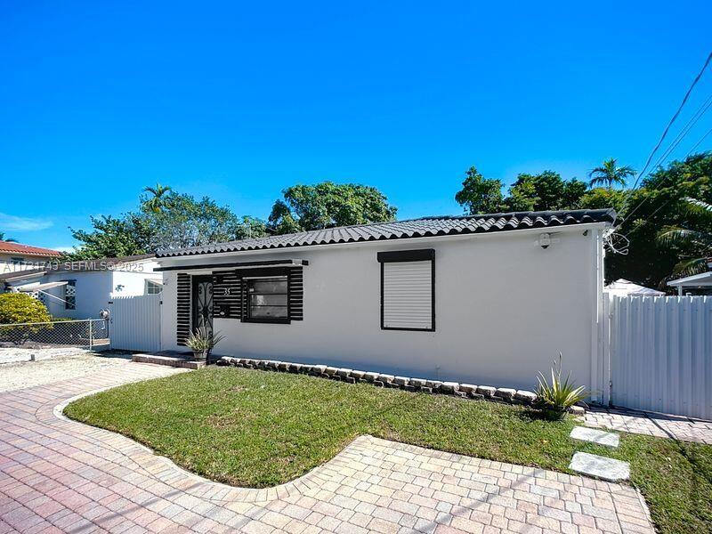35 Southwest 63rd Court Miami, FL 33144 - Photo 3 of 42 a view of a house with a yard