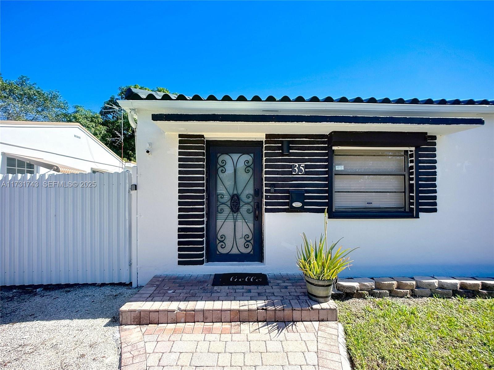35 Southwest 63rd Court Miami, FL 33144 - Photo 4 of 42 a view of a entryway door front of house