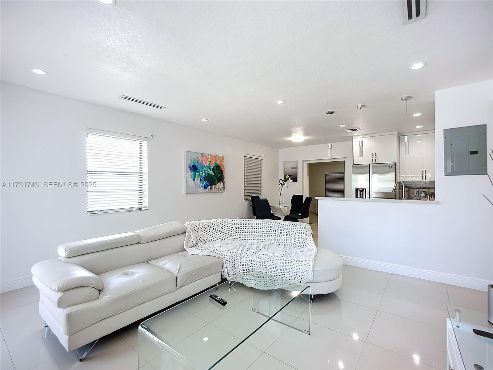 35 Southwest 63rd Court Miami, FL 33144 - Photo 6 of 42 a living room with furniture and kitchen view