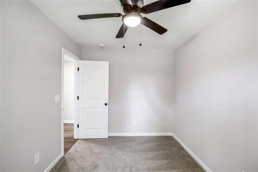 2159 Shiloh Road Greensboro, GA 30642 - Photo 26 of 43 an empty room with chandelier fan