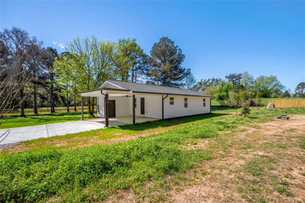 2159 Shiloh Road Greensboro, GA 30642 - Photo 29 of 43 a view of a house with backyard and trees