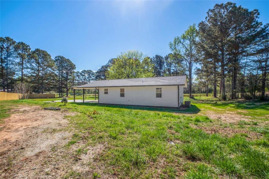 2159 Shiloh Road Greensboro, GA 30642 - Photo 31 of 43 a view of a house with backyard and trees