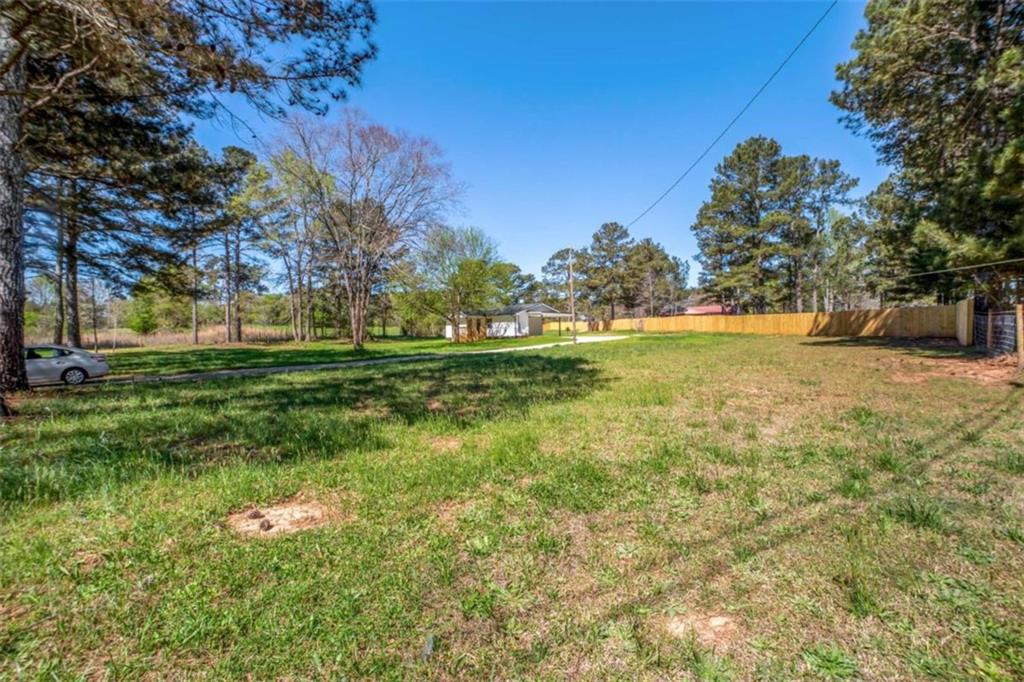 2159 Shiloh Road Greensboro, GA 30642 - Photo 33 of 43 a backyard of a house with lots of green space