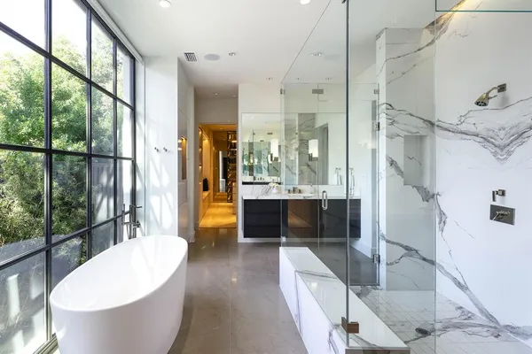 a bathroom with a bathtub and shower