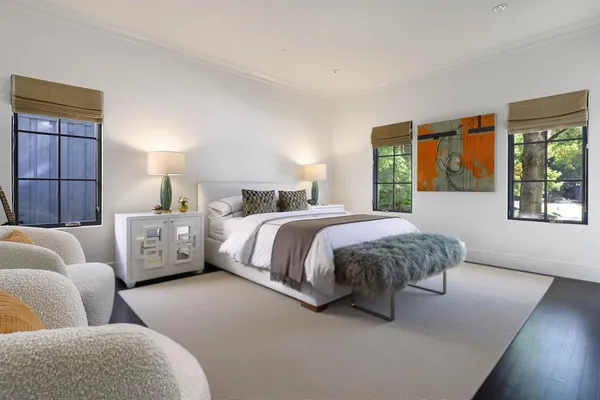 a bed room with a bed and a couch