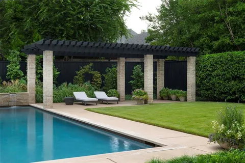 a view of a house with backyard sitting area and garden