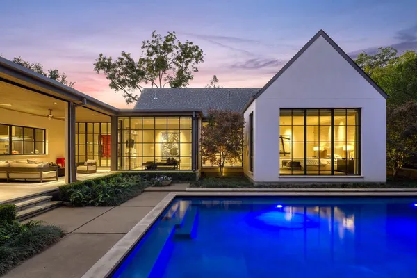 a view of swimming pool with outdoor seating