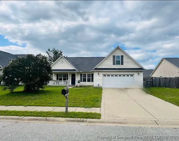 a bedroom with bed and window