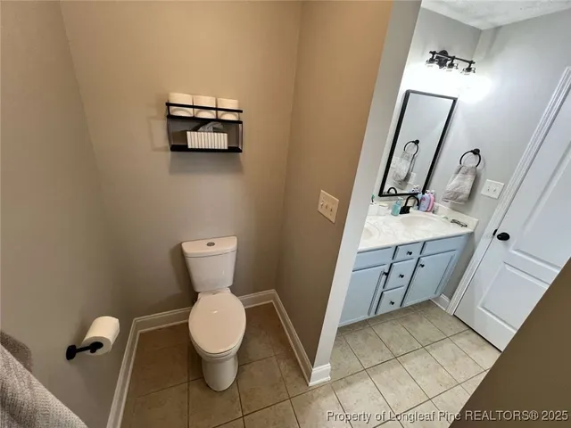 a livingroom with workspace and a window