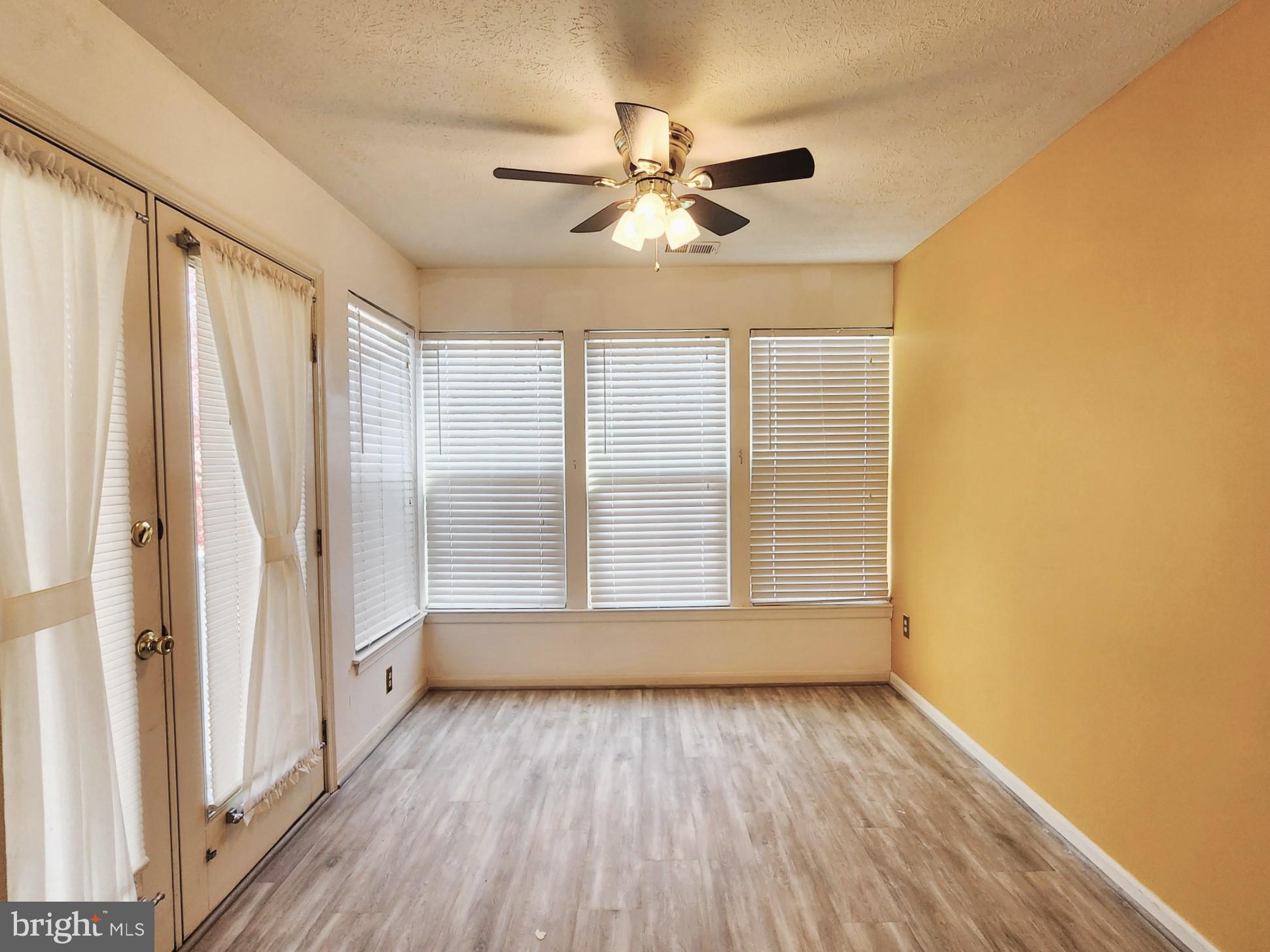 13 Locust Path Court, Unit 813 Nottingham, MD 21236 - Photo 11 of 23 wooden floor in an empty room with a window