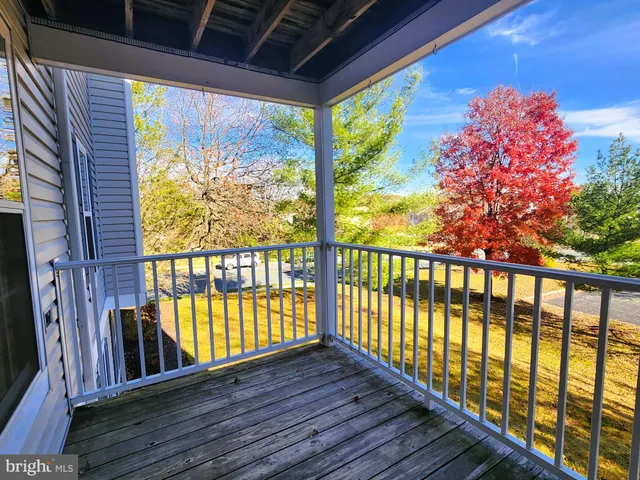 a view of porch with wooden floor
