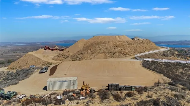 a view of a dry yard with a mountain