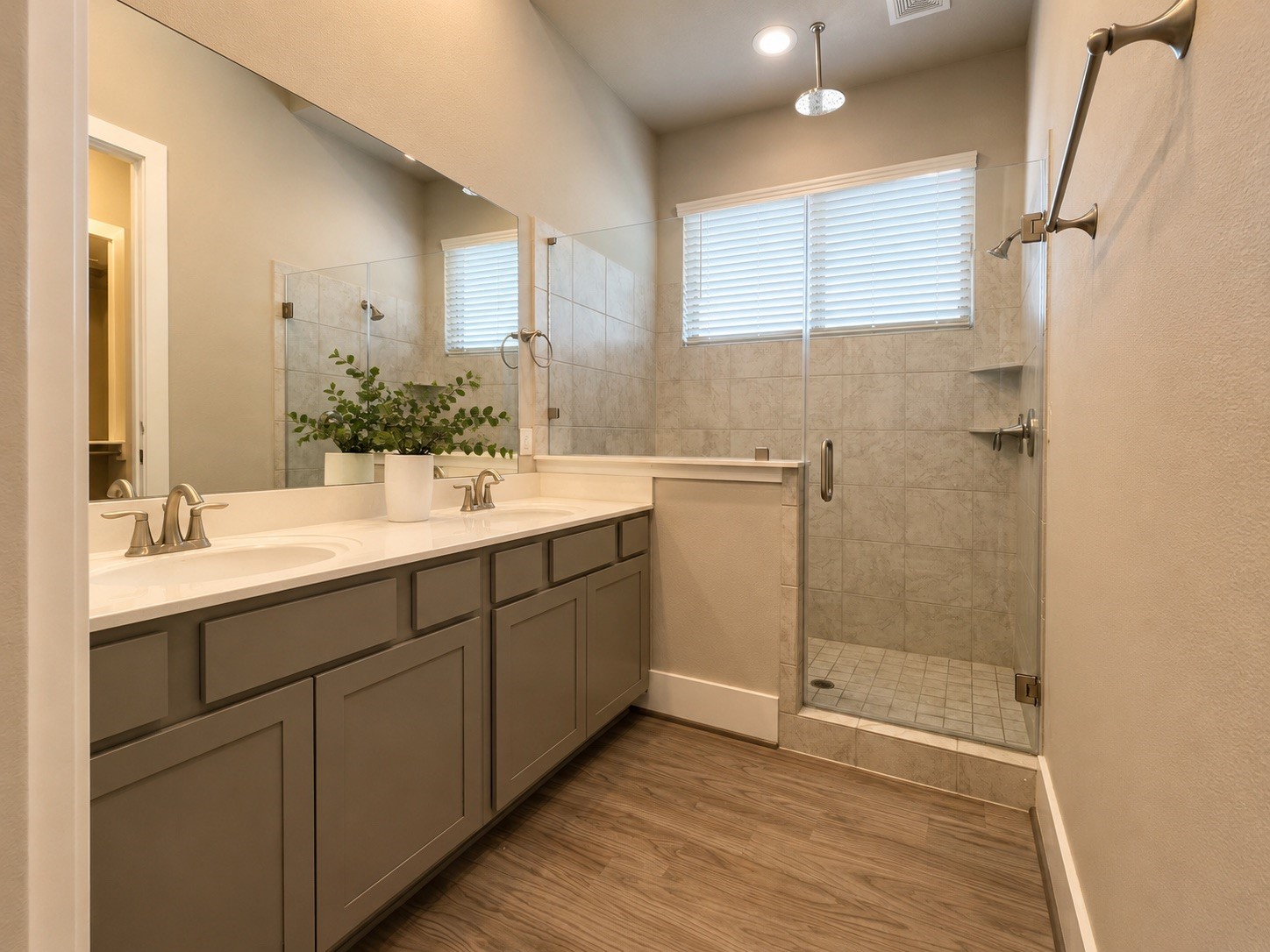 731 Janisch Road Houston, TX 77018 - Photo 13 of 19 Double sinks and a Texas size stand-up shower in the primary bathroom. Shower also has a bench.