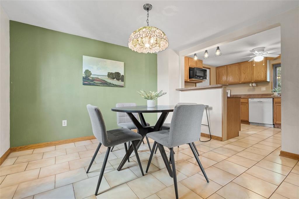 1670 Breining Street Pittsburgh, PA 15234 - Photo 12 of 39 a view of a dining room with furniture and chandelier