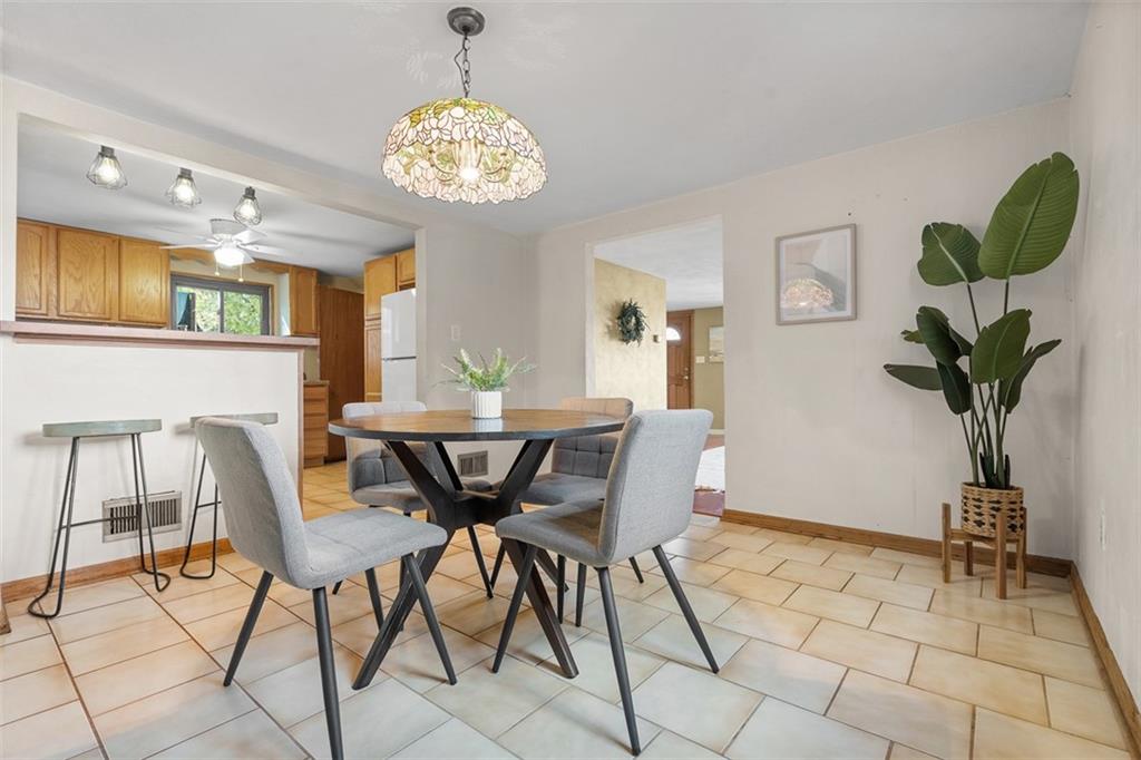 1670 Breining Street Pittsburgh, PA 15234 - Photo 13 of 39 a view of a dining room with furniture and chandelier