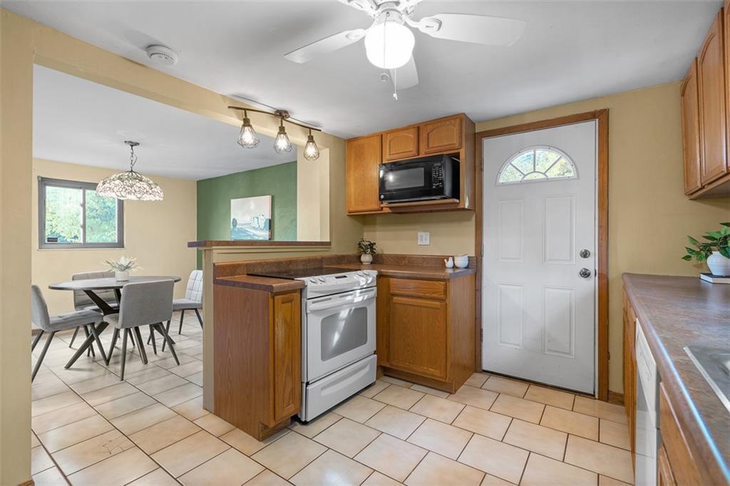1670 Breining Street Pittsburgh, PA 15234 - Photo 18 of 39 a kitchen with a cabinets and appliances