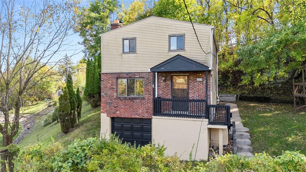 1670 Breining Street Pittsburgh, PA 15234 - Photo 2 of 39 a front view of a house with garden
