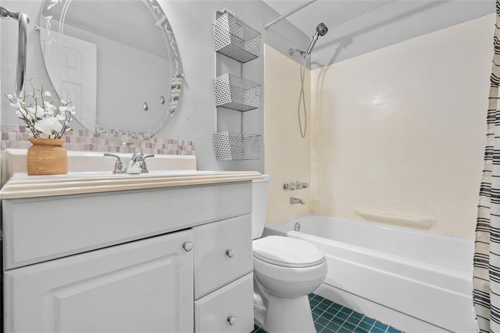 1670 Breining Street Pittsburgh, PA 15234 - Photo 24 of 39 a bathroom with a sink a toilet and shower