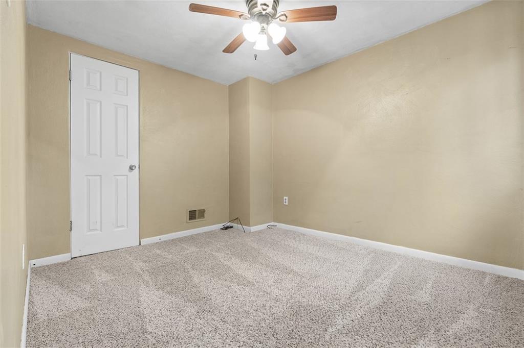 1670 Breining Street Pittsburgh, PA 15234 - Photo 25 of 39 an empty room with chandelier fan and windows