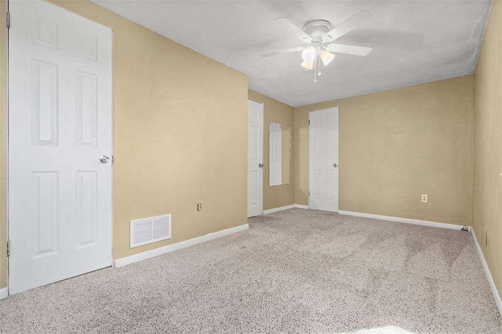1670 Breining Street Pittsburgh, PA 15234 - Photo 30 of 39 a view of a room with a ceiling fan and a chandelier fan