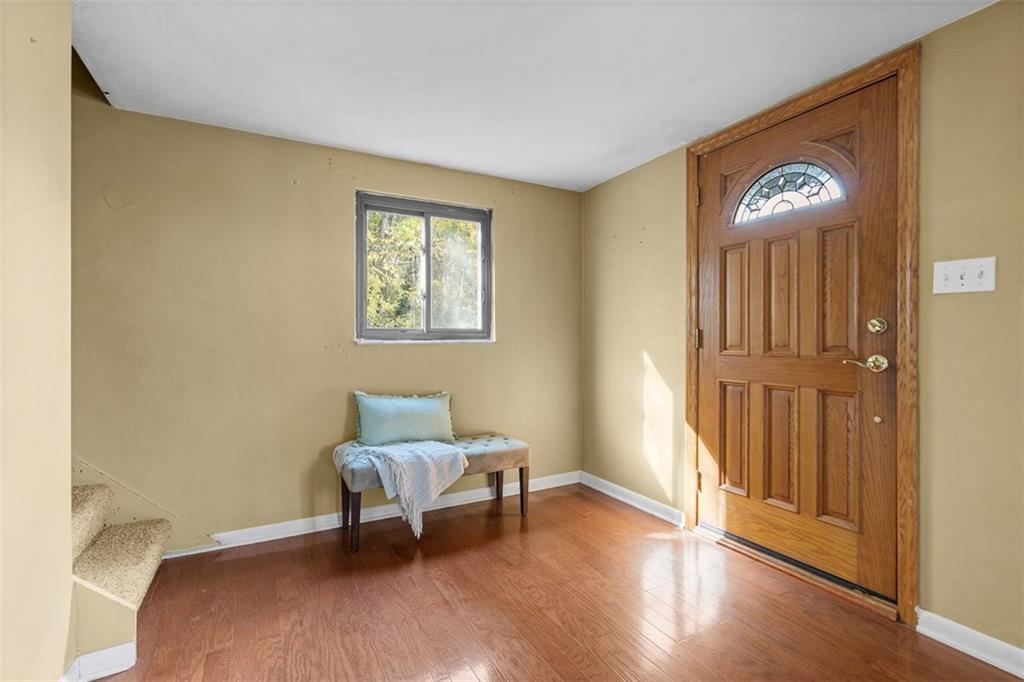 1670 Breining Street Pittsburgh, PA 15234 - Photo 5 of 39 a living room with furniture and a window
