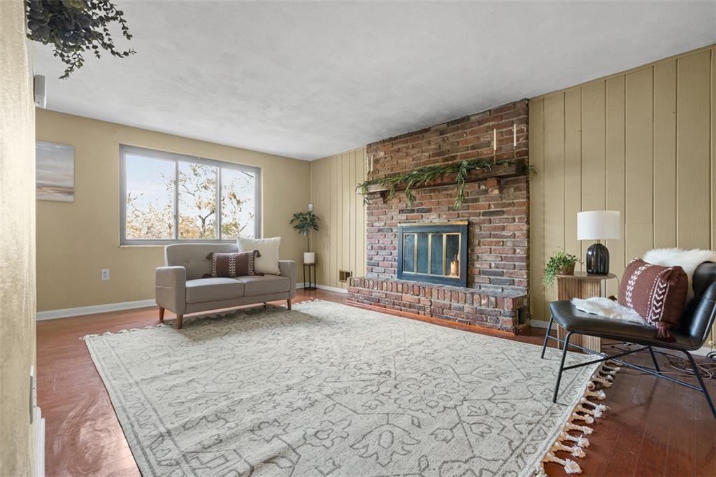 1670 Breining Street Pittsburgh, PA 15234 - Photo 9 of 39 a living room with furniture and a fireplace