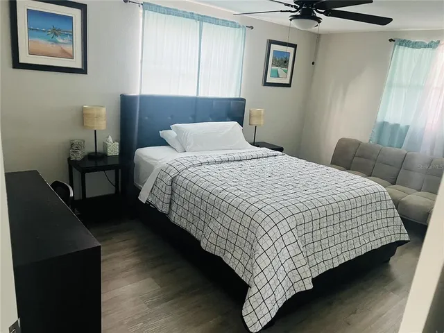 a bedroom with bed and window